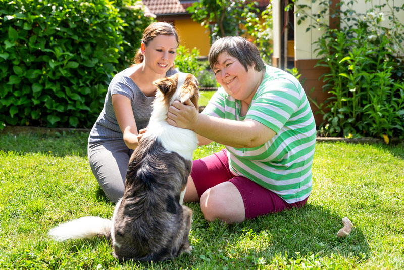 Disabled Woman With Her Pet — Disability Services In Townsville, QLD