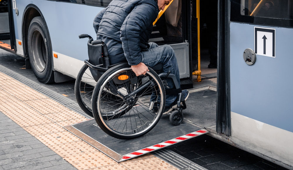 Man In A Wheelchair Riding A Public Vehicle
