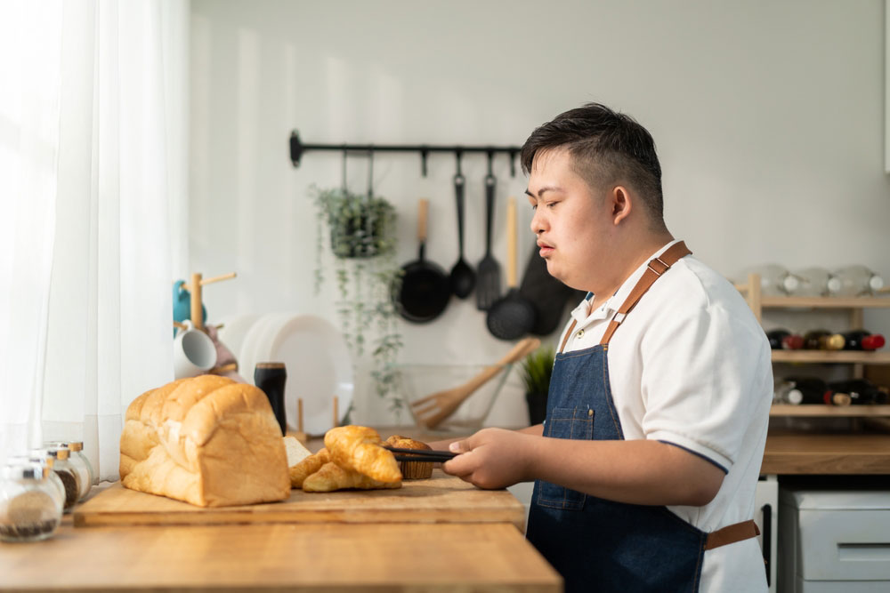 Man With Disability Preparing Bread