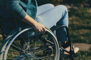 Woman In A Wheelchair At The Park