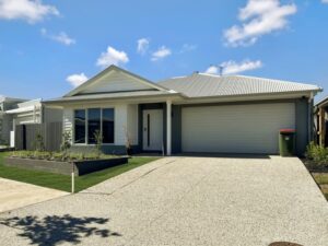 House with light brown roofing — Point Care Disability Services Rockhampton, QLD
