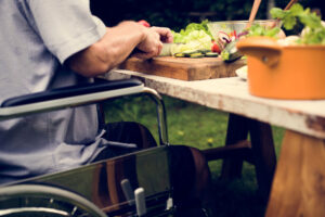 Man On Wheelchair Preparing Food