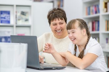 Girl With Her Teacher — Disability Services In Mackay, QLD