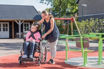 Child in a Wheelchair on the Playground — Disability Services in Toowoomba, QLD