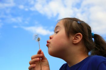 Girl Blowing Dandelion — Disability Services in Toowoomba, QLD