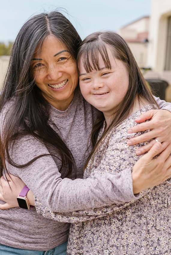 Carer And Child Hugging Each Other  — Disability Services & Support in Maroochydore, QLD