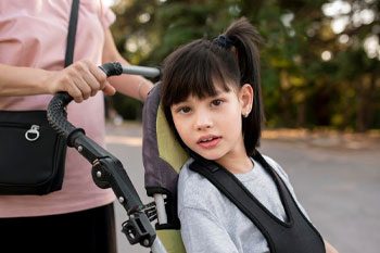 Child In A Wheelchair — Point Care Pty Ltd in Gladstone, QLD