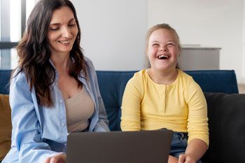 Front View Smiley Girl and Woman Indoors — Point Care Pty Ltd in Gladstone, QLD