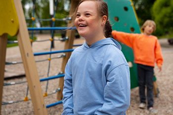Girl Smiling At The Playground — Disability Services & Support in Ipswich, QLD