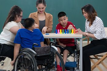 Group Of Special Students In Classroom — Disability Services & Support in Loganholme, QLD