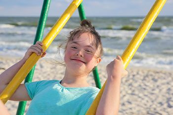 Little Girl Having Fun On The Swing — Disability Services & Support in Ipswich, QLD