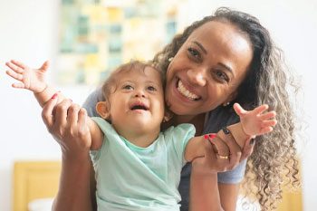 Photo Of A Parent With Her Baby — Disability Services & Support in Sunshine Coast, QLD