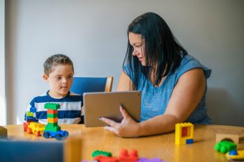 Mother Teaching Son — Disability Services In Townsville, QLD