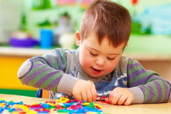 Kid Playing In Kindergarten — Disability Services In Townsville, QLD